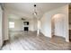Open-concept living space with fireplace seamlessly connecting to the kitchen area at 844 Braddock Way, Fort Mill, SC 29715