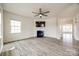 Living room featuring a fireplace, ceiling fan, and lots of natural light at 844 Braddock Way, Fort Mill, SC 29715