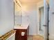 Bathroom featuring a classic vanity, mirror, lighting fixture, and tiled flooring at 9741 Turning Wheel Dr, Charlotte, NC 28214