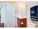 Bathroom features a wood vanity, framed mirror, and ceramic tile flooring at 9741 Turning Wheel Dr, Charlotte, NC 28214
