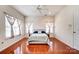 Bright bedroom with hardwood floors and natural light from the windows at 9741 Turning Wheel Dr, Charlotte, NC 28214