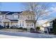 Inviting townhome showcasing neutral siding, mulched landscaping, and a cozy front porch at 9741 Turning Wheel Dr, Charlotte, NC 28214