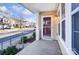 Cozy front porch featuring a storm door, vinyl siding, and neighborhood views at 9741 Turning Wheel Dr, Charlotte, NC 28214