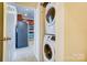 Hallway view of the stackable washer and dryer at 9741 Turning Wheel Dr, Charlotte, NC 28214