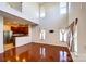Open concept living space with kitchen view and abundant natural light at 9741 Turning Wheel Dr, Charlotte, NC 28214