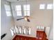 Bright living room features high ceilings, hardwood floors, large windows, and a modern ceiling fan at 9741 Turning Wheel Dr, Charlotte, NC 28214