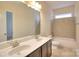 Bathroom with double vanity, tiled shower-tub combo and tile flooring at 1012 Equipoise Dr, Indian Trail, NC 28079