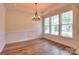 Bright dining room with decorative chandelier and large window with natural light at 1012 Equipoise Dr, Indian Trail, NC 28079
