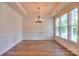 Bright dining room with decorative chandelier and large window with natural light at 1012 Equipoise Dr, Indian Trail, NC 28079