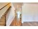 Inviting foyer featuring hardwood floors and staircase leading to the upper level at 1012 Equipoise Dr, Indian Trail, NC 28079