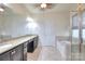 Main bathroom with granite countertops, dual sinks, soaking tub, and glass-enclosed shower at 1012 Equipoise Dr, Indian Trail, NC 28079