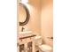 Classic powder room with a stylish vanity, vessel sink, and oval mirror at 1012 Equipoise Dr, Indian Trail, NC 28079