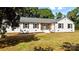 Charming single-story home featuring a light-colored exterior, a welcoming front porch, and black shutters at 1131 Doby Ct, Fort Mill, SC 29715