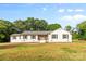 Charming white home with a welcoming blue door and well-manicured lawn on a sunny day at 1131 Doby Ct, Fort Mill, SC 29715