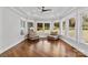 Inviting living room with abundant natural light, tray ceiling, hardwood floors, and comfortable seating area at 1131 Doby Ct, Fort Mill, SC 29715