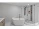Bright bathroom with a soaking tub, enclosed shower with rainfall shower head and stylish fixtures at 1131 Doby Ct, Fort Mill, SC 29715