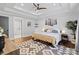 Bright main bedroom boasts tray ceiling, wood floors and ensuite bathroom with soaking tub at 1131 Doby Ct, Fort Mill, SC 29715