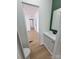 Bathroom featuring a sink, a toilet, and wood-look flooring with an open doorway at 1170 Meadowcreek Dr, China Grove, NC 28023