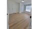 Bedroom with wood-look flooring and two closets and natural light from the window at 1170 Meadowcreek Dr, China Grove, NC 28023