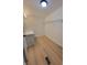 Spacious walk-in closet with wood-look flooring, shelving, and a built-in countertop at 1170 Meadowcreek Dr, China Grove, NC 28023