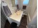 Bright bathroom featuring a white sink, tiled walls, and modern fixtures at 128 Cromer St, Charlotte, NC 28208