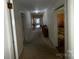 Long hallway with carpet flooring that connects various rooms in the house at 128 Cromer St, Charlotte, NC 28208