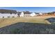 A large grassy backyard abuts other homes at 12915 Deaton Hill Dr, Charlotte, NC 28269
