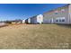 View of the grassy backyard with a wood fence at 12915 Deaton Hill Dr, Charlotte, NC 28269