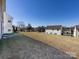 A large grassy backyard provides lots of room to play at 12915 Deaton Hill Dr, Charlotte, NC 28269