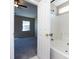 Bathroom featuring a shower/tub combo and a partial view into the bedroom at 12915 Deaton Hill Dr, Charlotte, NC 28269