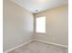 Bedroom featuring neutral carpet, a large window, and bright white walls at 12915 Deaton Hill Dr, Charlotte, NC 28269