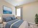 Bedroom featuring large bed, modern decor, and natural light from the window at 12915 Deaton Hill Dr, Charlotte, NC 28269
