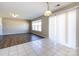 Bright dining room with a combination of tile and hardwood flooring, plus sliding glass door access at 12915 Deaton Hill Dr, Charlotte, NC 28269