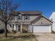 Inviting two-story home with a well-kept lawn, complemented by a classic design and ample parking at 12915 Deaton Hill Dr, Charlotte, NC 28269