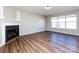 Spacious living room with hardwood floors, fireplace, and natural light, ready for personalization at 12915 Deaton Hill Dr, Charlotte, NC 28269