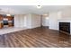 Expansive open living space connecting the living room, dining area, and kitchen featuring new appliances at 12915 Deaton Hill Dr, Charlotte, NC 28269