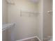Walk-in closet featuring installed wire shelving and neutral carpet and walls at 12915 Deaton Hill Dr, Charlotte, NC 28269