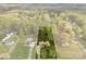 An aerial view showcasing the property's spacious lot and its surrounding tree coverage at 1335 Blacksnake Rd, Stanley, NC 28164