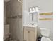 Beautiful bathroom featuring a shower, sink, mirror, and modern fixtures at 1335 Blacksnake Rd, Stanley, NC 28164