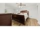 Spacious bedroom features a ceiling fan, wood floors, and lots of natural light at 1335 Blacksnake Rd, Stanley, NC 28164