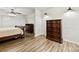 Cozy bedroom showcasing dark wooden dresser and flooring with natural light at 1335 Blacksnake Rd, Stanley, NC 28164