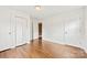 Bright bedroom with hardwood floors, closet and doorway with natural lighting at 1335 Blacksnake Rd, Stanley, NC 28164