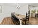 Formal dining area featuring a chandelier and wood laminate floors at 1335 Blacksnake Rd, Stanley, NC 28164