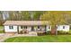 Attractive single-story home featuring a welcoming front porch and lush green lawn at 1335 Blacksnake Rd, Stanley, NC 28164