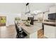 Kitchen with an island, granite countertops, white cabinetry and stainless appliances at 1335 Blacksnake Rd, Stanley, NC 28164