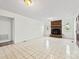 Spacious living room with tile floors centered around a fireplace at 1335 Blacksnake Rd, Stanley, NC 28164