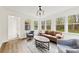 Sun-filled living room offering hardwood floors and serene backyard views at 1335 Blacksnake Rd, Stanley, NC 28164