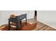 Close-up of a home office with black modern desk on cow-print rug at 1335 Blacksnake Rd, Stanley, NC 28164