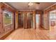 Wood-paneled bedroom with large closets and natural light, creating a warm and inviting space at 136 Coble Ave, Albemarle, NC 28001