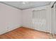 Bright bedroom with hardwood floors, a large window, and detailed trim for a cozy feel at 136 Coble Ave, Albemarle, NC 28001